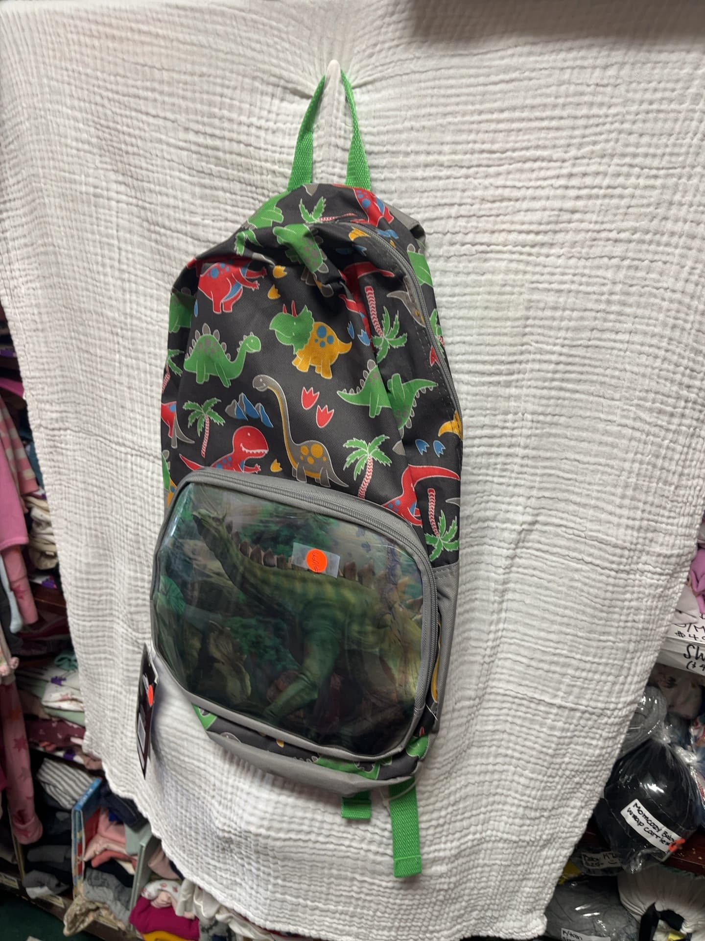 Dinosaur Print Sling Backpack with Clear Front Pocket